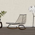 Modern Woven Wooden Rocking Chair With Feather Floor Lamp And Green Plant In Beige Room