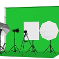Professional Commercial Photography Equipment Setup With Lights Reflectors Tripods And Green Background
