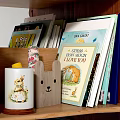 Tree Shaped Wooden Bookshelves With Various Books And Small Decorative Ornaments