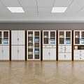 Row Of Modern White Bookcases With Glass Doors And Wooden Shelves On Herringbone Floor