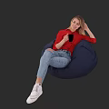 Woman Sitting On Blue Bean Bag Chair In Red Top Ripped Jeans Holding Black Cup