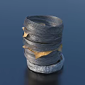 Stacked Coiled Gray And Silver Metal Wires With Golden Sheets And Silver Base