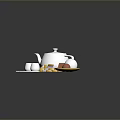 Household Items Collection Featuring White Teapot Cups Tea Bags And Eggs On Plate