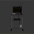 Old Style Computer Monitor On Wheeled Cart With Lower Shelf Equipment