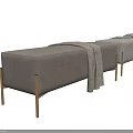 Modern Gray Sofa Bench With Soft Upholstery Golden Metal Legs And Cozy Blanket