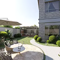 Garden Landscape Design With Outdoor Leisure Area Umbrella Wicker Furniture Trimmed Bushes And Stone Path