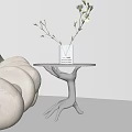Modern Metallic Side Table With Curved Legs Transparent Vase Yellow Flowers White Candle Beige Sofa