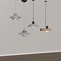 Modern Minimalist Pendant Lights With Various Designs And Different Colors Hanging Against White Background