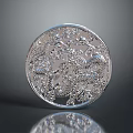 Shiny Silver Round Object With Intricate Carved Patterns And Detailed Design
