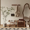 Modern Entryway With Curved Mirror Coat Rack Plant Stool And Geometric Rug