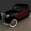 Vintage Black and Red Classic Car with Chrome Grille and White Wall Tires
