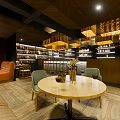 Warm Cafe Interior Design With Wooden Ceiling Pendant Lights Round Table And Green Chairs