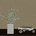 White Square Vase With White Flowers Against Light Colored Wall And White Box