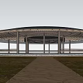 Scenic Circular Open Air Pavilion With Person Walking On Path In Wheat Field