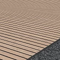 Natural Light Brown Wooden Flooring With Horizontal Planks And Adjacent Gravel