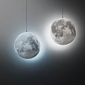 Two Moon Shaped Pendant Lights With Textured Surface For Modern Interior Design 3d model