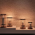 Decorative Ornament Set with Glass Covered Candle Holders Wooden Bases on Light Colored Shelf