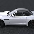 White Jaguar Convertible Sports Car With Black Top And Sleek Exterior Design