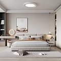 Modern Bedroom Interior Design With Beige Bed Multiple Pillows Rug Wall Painting And Round Mirror