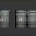 Group of Silver Metal Drums With Green Ropes And Warning Labels