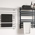 Black and White Towels Hanging on Wall Mounted Towel Racks with Bath Products