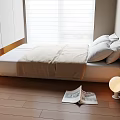Tatami Bedroom Interior With Wooden Floor White Pillows Beige Blanket Open Book And Round Lamp