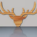Wooden Deer Head Decoration With Natural Wood Grain On Light Colored Wall And Smooth Countertop