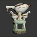 White Ceramic Bird Sculpture With Multiple Birds Standing On Green Base