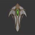 Futuristic Metallic Accessory With Silver Gold Finish Central Green Gemstone And Streamlined Wing Like Structures