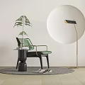 Green Accent Chair With Metal Armrests Side Table Potted Plant Floor Lamp Round Decorative Wall Gray Rug