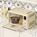 Beige Microwave Oven With Open Door And Baking Tray On Spotted Kitchen Countertop