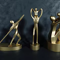 Golden Modern Metal Sculptures Featuring Abstract Human Throwing Holding And Embracing Figures