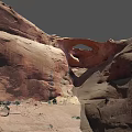 Natural Red Sandstone Rock Arch With Surrounding Desert Vegetation And Landscape