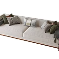 Modern Beige Sectional Sofa With Green And Grey Throw Pillows And Wooden Legs