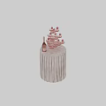 Pink Champagne Bottle With Decorated Wine Glasses On Fringed Round Table