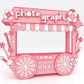 Pink Flower Decorated Photo Spot Cart With Striped Awning And Photograph Sign