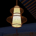 Traditional Chinese Lantern With Handwoven Bamboo Frame Illuminated Hanging Over Tile Roof