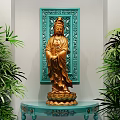 Elegant Console Table with Golden Guanyin Statue and Blue Carved Backdrop Flanked by Green Plants