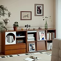 Modern Wooden Bookcase With Potted Plant Framed Pictures Stacked Books And Decorative Items