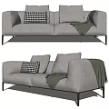 Light Grey Two Seater Sofa With Black Checkered Pillow Green Throw Blanket Black Metal Legs