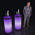 Purple Illuminated Cylindrical Bar Counters With Wine Glasses And Man In Suit Standing Beside