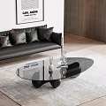 Modern Black Glass Coffee Table With Decorative Items In Contemporary Living Room