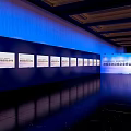 Tobacco And Alcohol Store Wine Industry Summit In Conference Hall With Screens Blue Seats Lighting