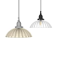 Modern Pendant Lights With White And Black Scalloped Translucent Shades Illuminated On Light Colored Wall