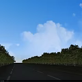 Wide Road Facilities Featuring Trees Yellow Dividing Lines White Lane Lines Blue Sky White Clouds