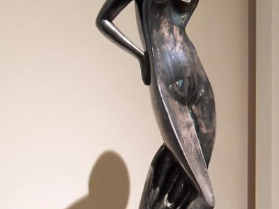 Abstract Metal Sculpture Carving Featuring Curved Human Figure In Indoor 3d model