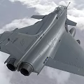 Modern Gray Fighter Jet Flying in Cloudy Sky with Landing Gear and Armaments