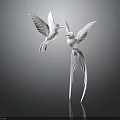 Two White Birds Sculpture With Spread Wings And Long Tail Feathers On Dark Reflective Background