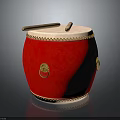 Red Musical Drum Featuring Golden Decorative Rings And Wooden Drumsticks On Surface