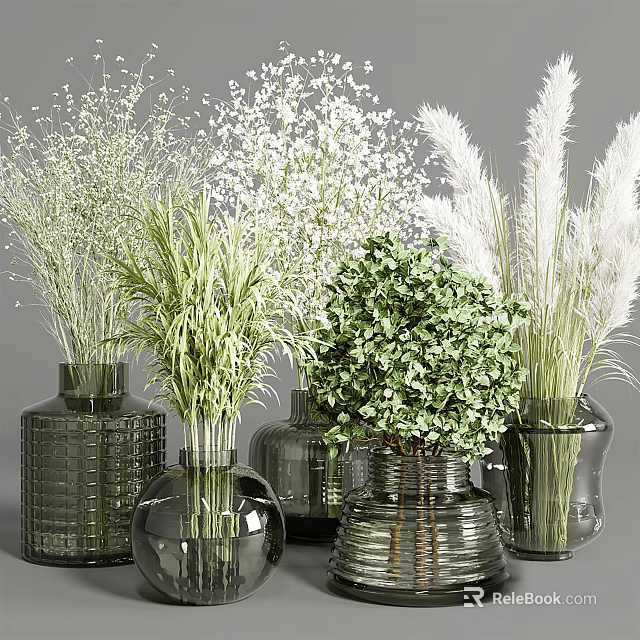 Various Textured Glass Vases Arranged With White Small Flowers Green Leafy Plants And Pampas Grass 3d model 
